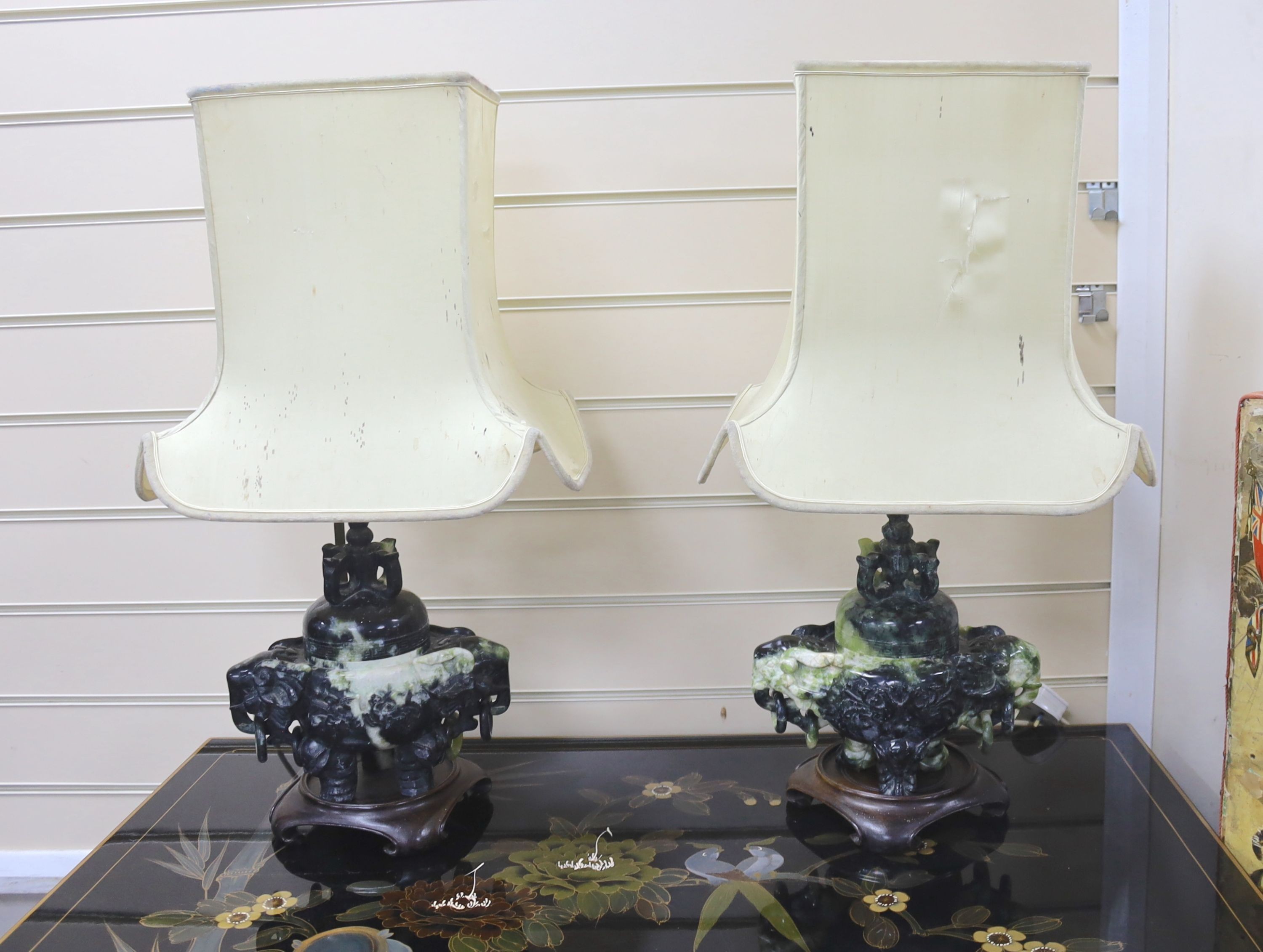 A pair of mid 20th century Chinese hardstone tripod censers on lamp stands, including stand 30 cms high.
